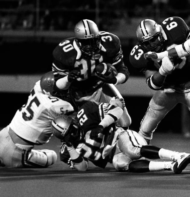 Ickey Woods carries the ball against San Jose State in this 1986 game. Photo by Russell Yip. Sl ...