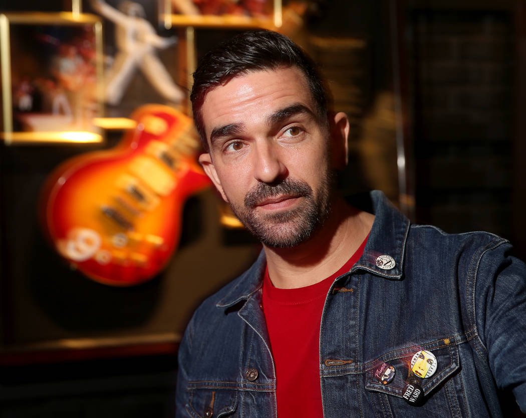 Hard Rock exhibition coordinator Beau Dobney at a new rock memorabilia exhibit at the Hard Rock ...