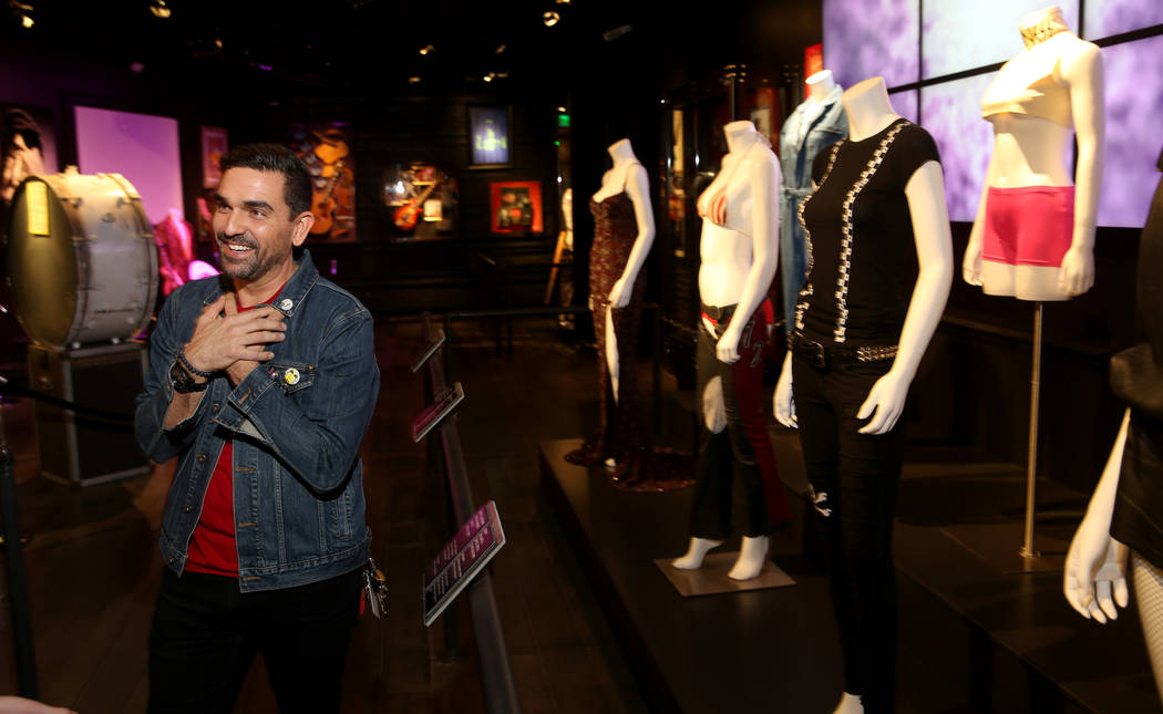 Hard Rock exhibition coordinator Beau Dobney at a new rock memorabilia exhibit at the Hard Rock ...