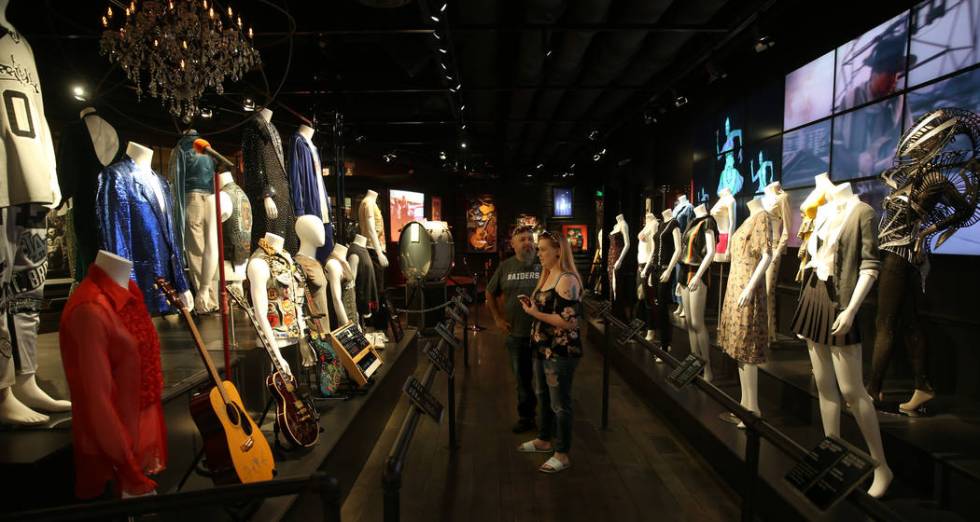 Lupe and Stefanie Cuevas, of Fresno, Calif., at a new rock memorabilia exhibit at the Hard Rock ...