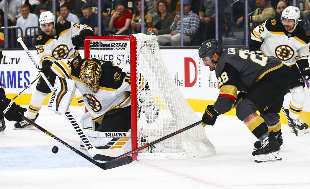 Boston Bruins goaltender Tuukka Rask (40) blocks a shot from Golden Knights' William Carrier (2 ...