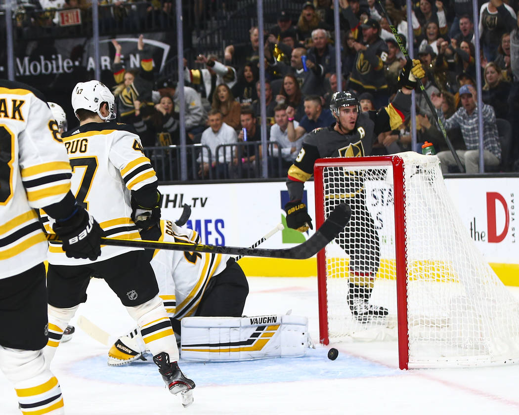 Golden Knights' Reilly Smith, upper right, celebrates his goal against the Boston Bruins during ...