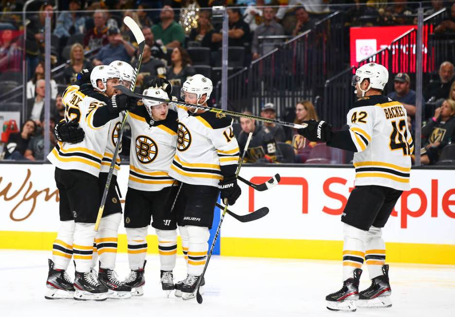 The Boston Bruins celebrate after scoring against the Golden Knights during the second period o ...