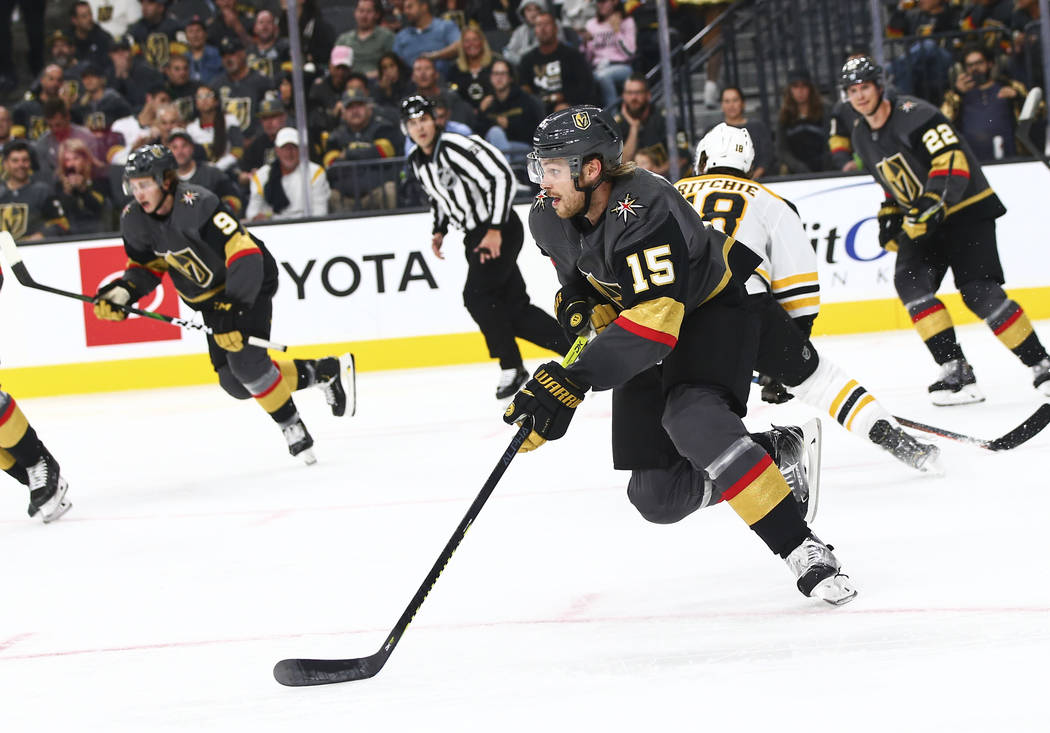 Golden Knights' Jon Merrill (15) skates with the puck during the second period of an NHL hockey ...