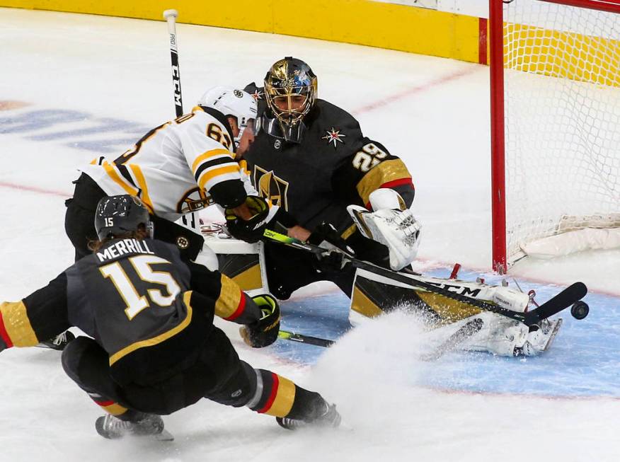 Golden Knights goaltender Marc-Andre Fleury (29) blocks a shot from Boston Bruins' Brad Marchan ...