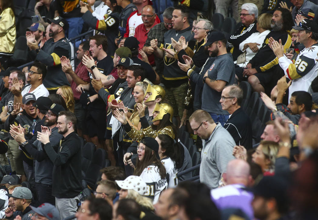 Golden Knights fans celebrate a goal against the Boston Bruins during the third period of an NH ...