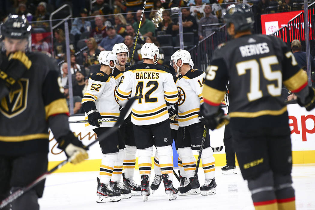 The Boston Bruins celebrate after scoring against the Golden Knights during the second period o ...