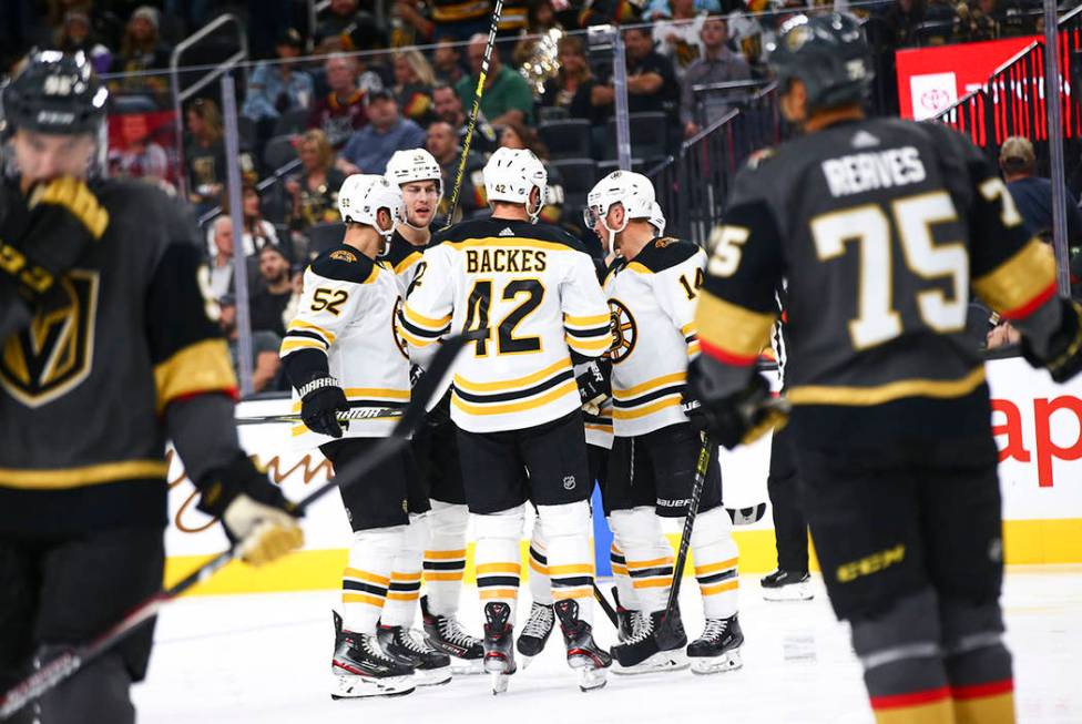 The Boston Bruins celebrate after scoring against the Golden Knights during the second period o ...