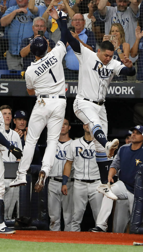 Tampa Bay Rays' Willy Adames (1) celebrates his solo home run against the Houston Astros with r ...
