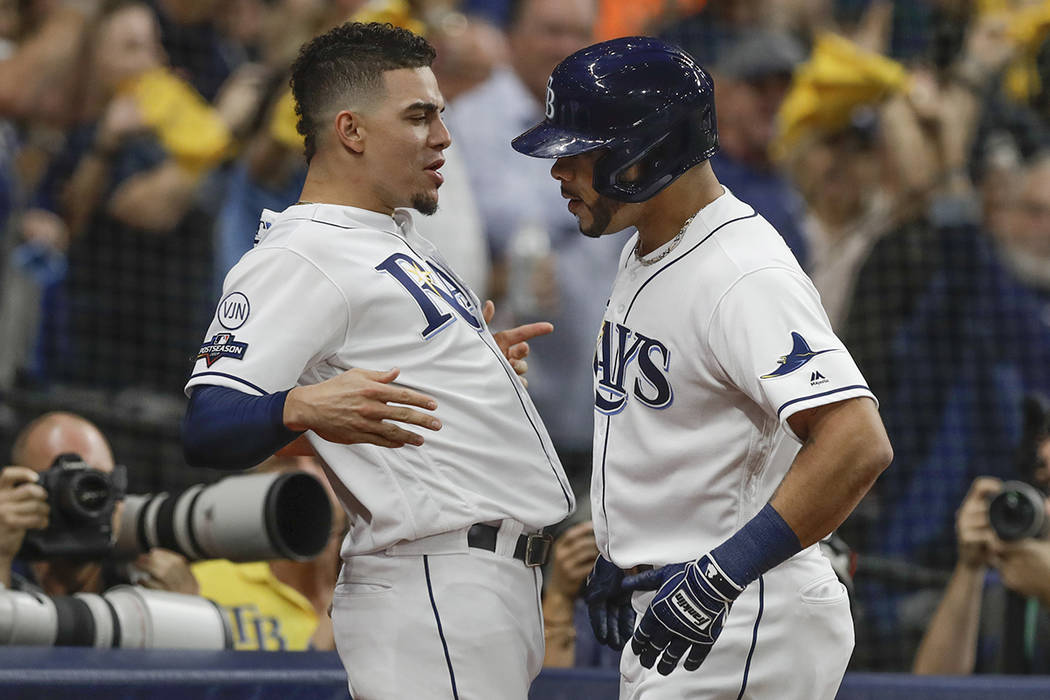 Tampa Bay Rays' Tommy Pham, right, celebrates his home run against the Houston Astros with team ...