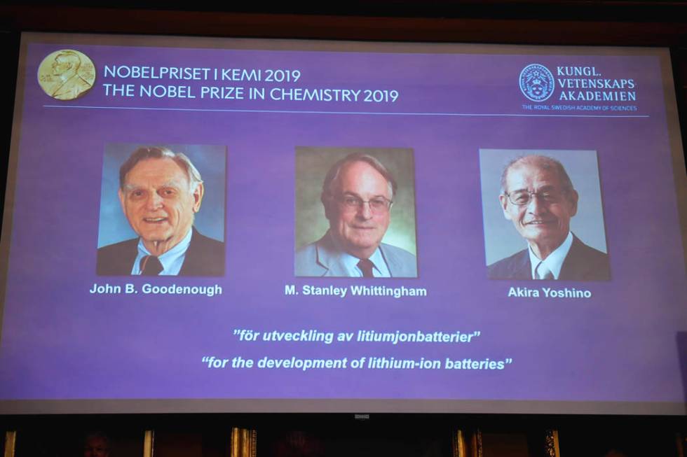 A screen displays the laureates of the 2019 Nobel Prize in Chemistry, from left, John B. Gooden ...