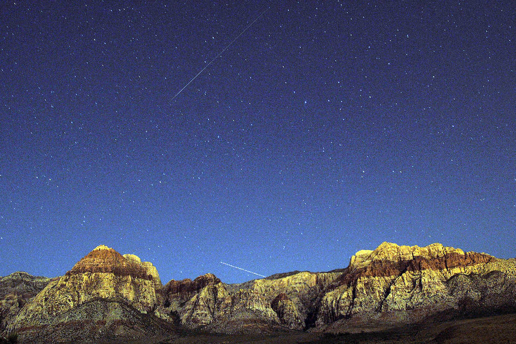 The walls of Red Rock Canyon outside of Las Vegas glow under the celestial lights late Tuesday, ...