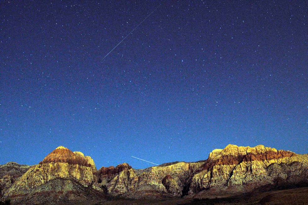The walls of Red Rock Canyon outside of Las Vegas glow under the celestial lights late Tuesday, ...