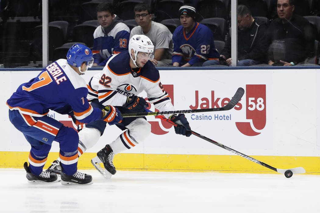 New York Islanders center Jordan Eberle (7) defends against Edmonton Oilers right wing Tomas Ju ...