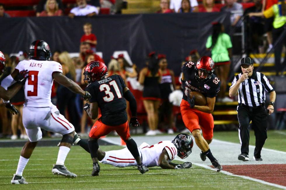 UNLV Rebels wide receiver Jacob Gasser (82) runs past Arkansas State Red Wolves cornerback Jari ...