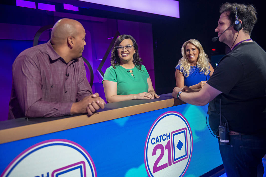 Contestants wait for production to begin on an episode of the game show "Catch 21," filmed at C ...