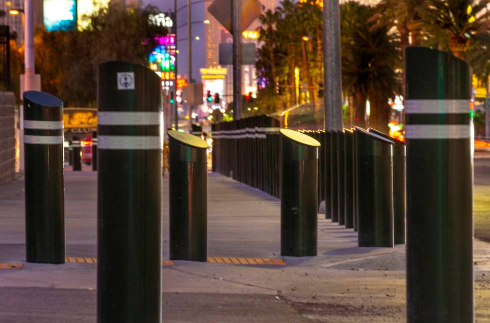 Various sizes of bollards are seen near an exit onto Las Vegas Boulevard South just u ...