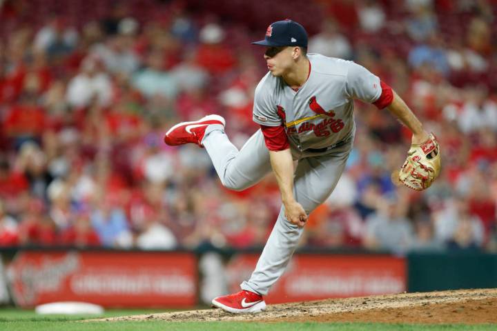 St. Louis Cardinals relief pitcher Ryan Helsley throws against the Cincinnati Reds during the e ...