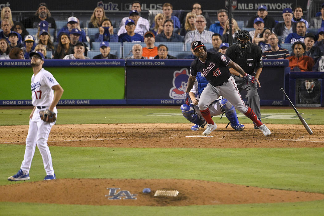 Washington Nationals' Howie Kendrick (47) watches his grand slam off Los Angeles Dodgers relief ...