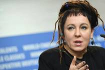In a Feb. 12, 2017, photo Polish author Olga Tokarczuk spekas during a press conference in Berl ...