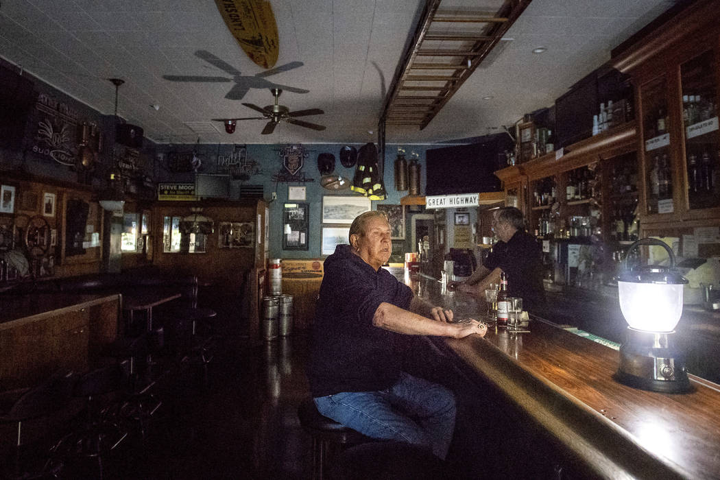 Joseph Pokorski drinks a beer at The Town Square as downtown Sonoma, Calif., remains without po ...