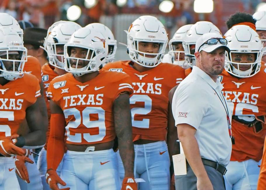 Texas head coach Tom Herman waits with his team before the start of an NCAA college football ga ...
