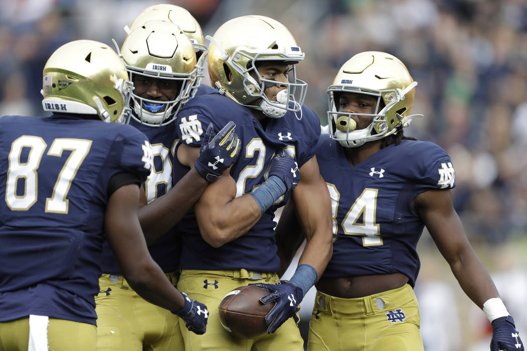 Notre Dame tight end Tommy Tremble (24) celebrates after scoring a touchdown during the first h ...