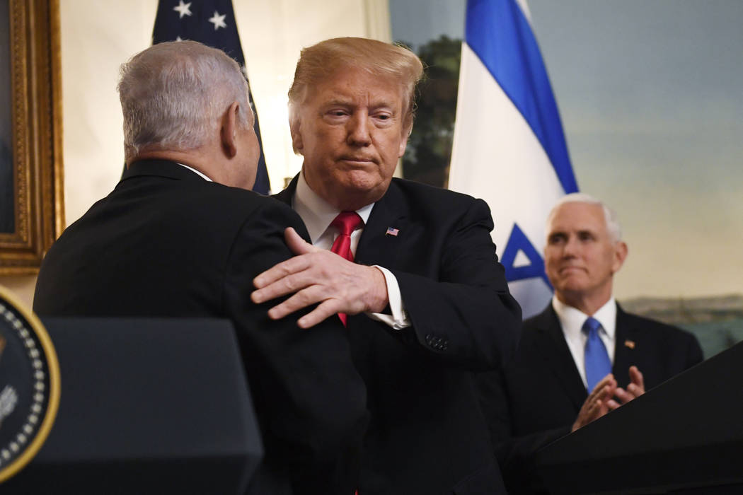 FILE - In this March 25, 2019, file photo, President Donald Trump embraces Israeli Prime Minist ...
