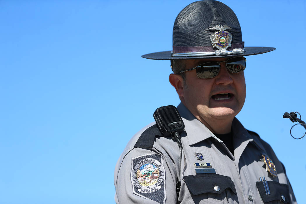 Nevada Highway Patrol spokesman Travis Smaka speaks during the DUI Victim Memorial Sign Dedicat ...