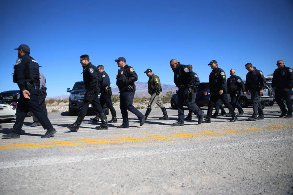 Multi-agency law enforcement officers participate during the DUI Victim Memorial Sign during a ...