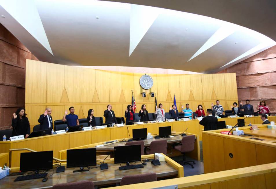 Members of the Asian-American Pacific Islanders Community Commission are sworn in at the Clark ...