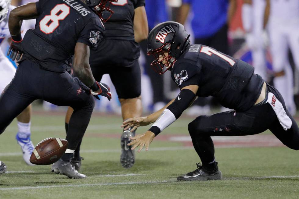 UNLV Rebels quarterback Kenyon Oblad tries to recover a fumble during the first half of an NCAA ...