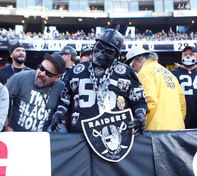 This fellow's shield protects him from evil spirits, like opposing fans. (Heidi Fang/Las Vegas ...