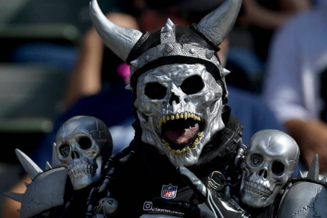 This intimidating fan's yellowing teeth seem to suggest they've had a head start on Halloween c ...