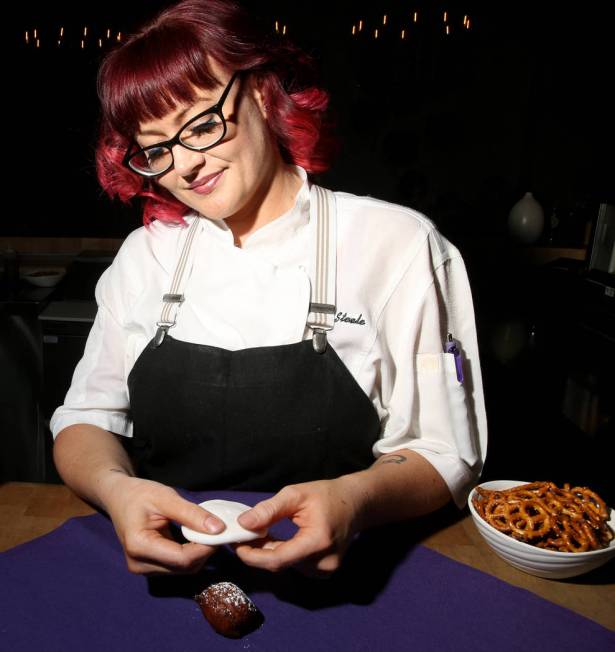 Pastry chef Sara Steele makes a Halloween ghost using fondant over a donut hole at Chica at The ...