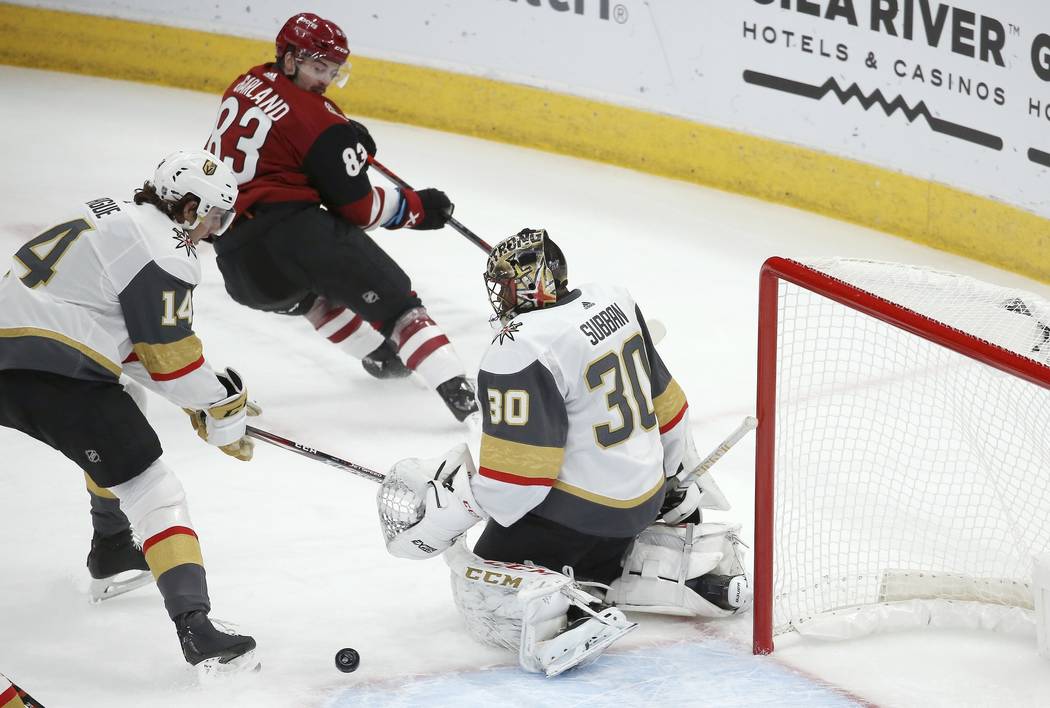 Arizona Coyotes right wing Christian Fischer (36) has his shot stopped by Vegas Golden Knights ...