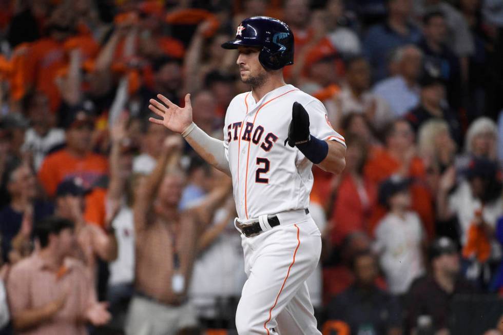 Houston Astros third baseman Alex Bregman (2) scores against the Tampa Bay Rays during the firs ...