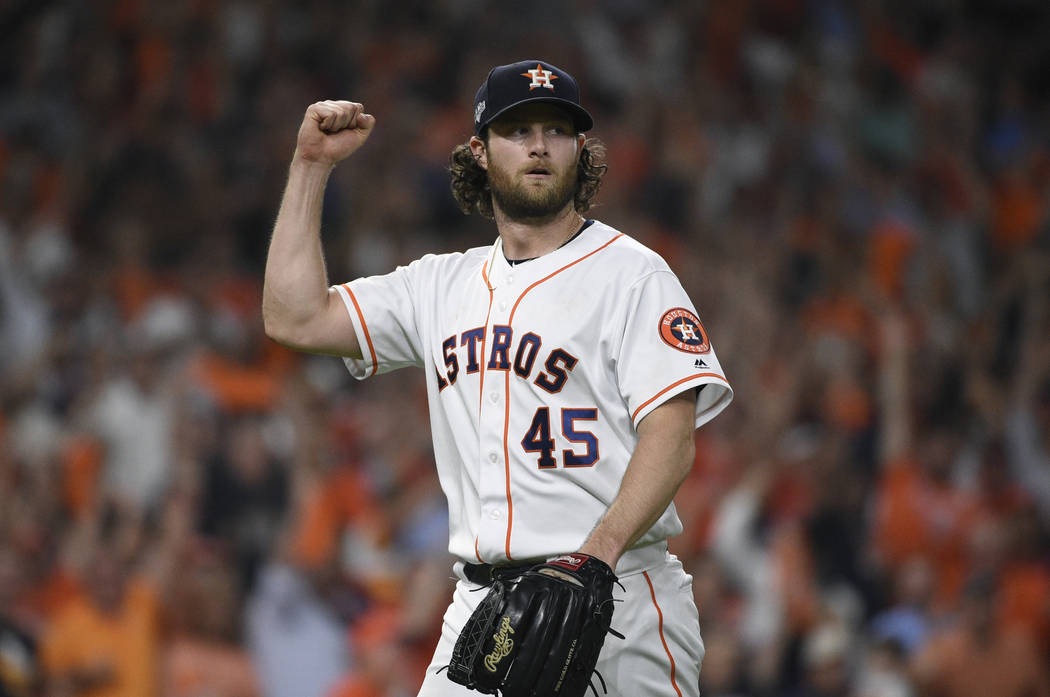 Houston Astros starting pitcher Gerrit Cole (45) reacts after an out against the Tampa Bay Rays ...