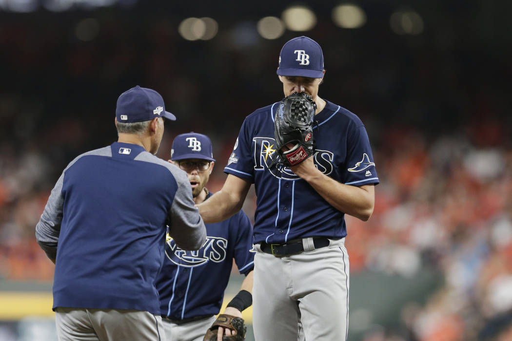 Tampa Bay Rays starting pitcher Tyler Glasnow, right, is pulled during the third inning of Game ...