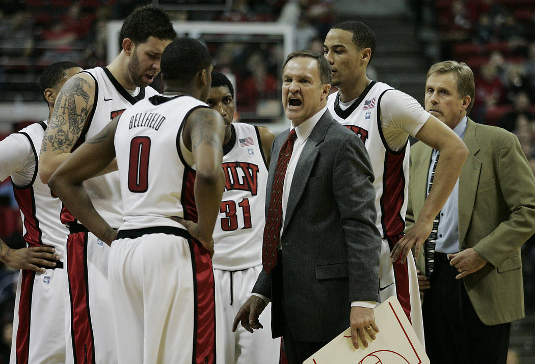 UNLV head coach Lon Kruger tries to motivate his team during a timeout against the Air Force Ac ...