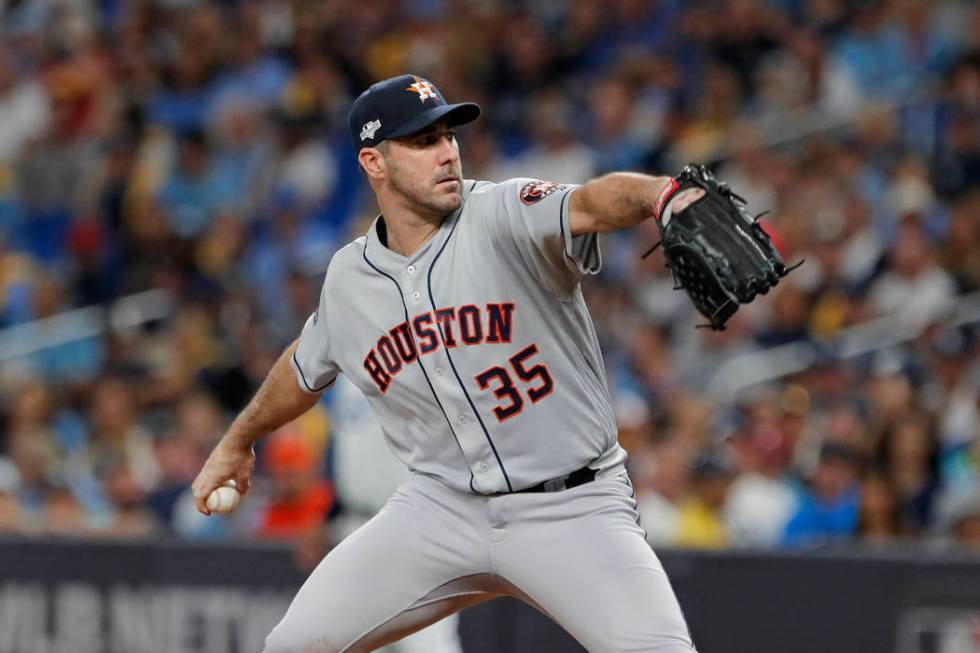 Houston Astros' Justin Verlander pitches against the Tampa Bay Rays in the first inning of Game ...