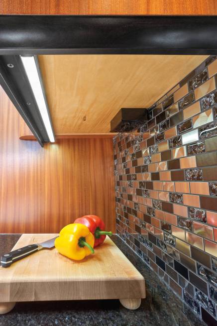 Under-cabinet lighting can be turned to the side to highlight the backsplash or turned downward ...