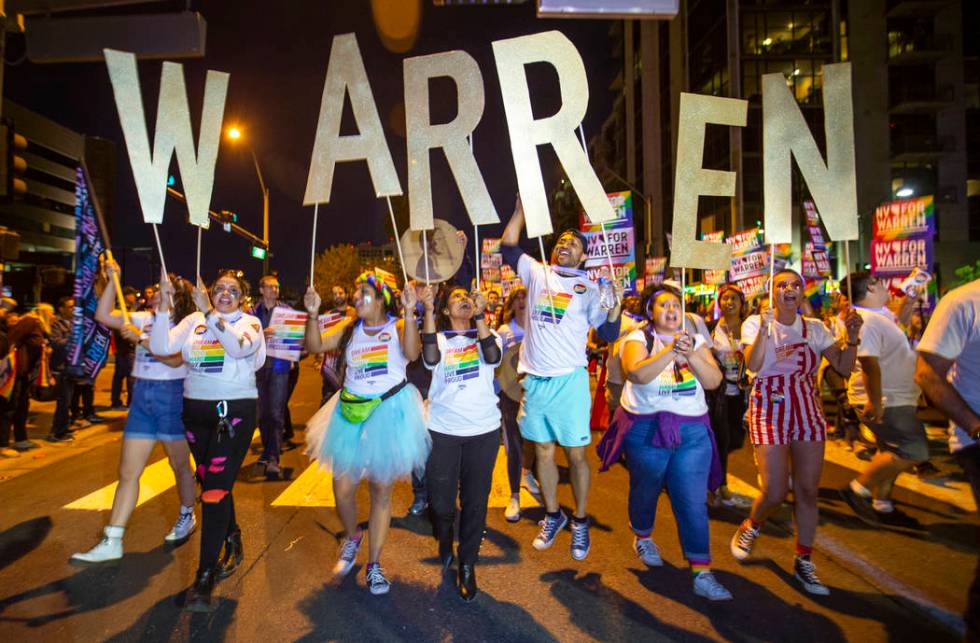 Supporters of Democratic presidential candidate Sen. Elizabeth Warren, D-Mass., marching in the ...