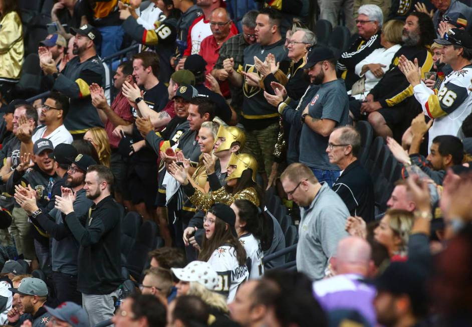 Golden Knights fans celebrate a goal against the Boston Bruins during the third period of an NH ...