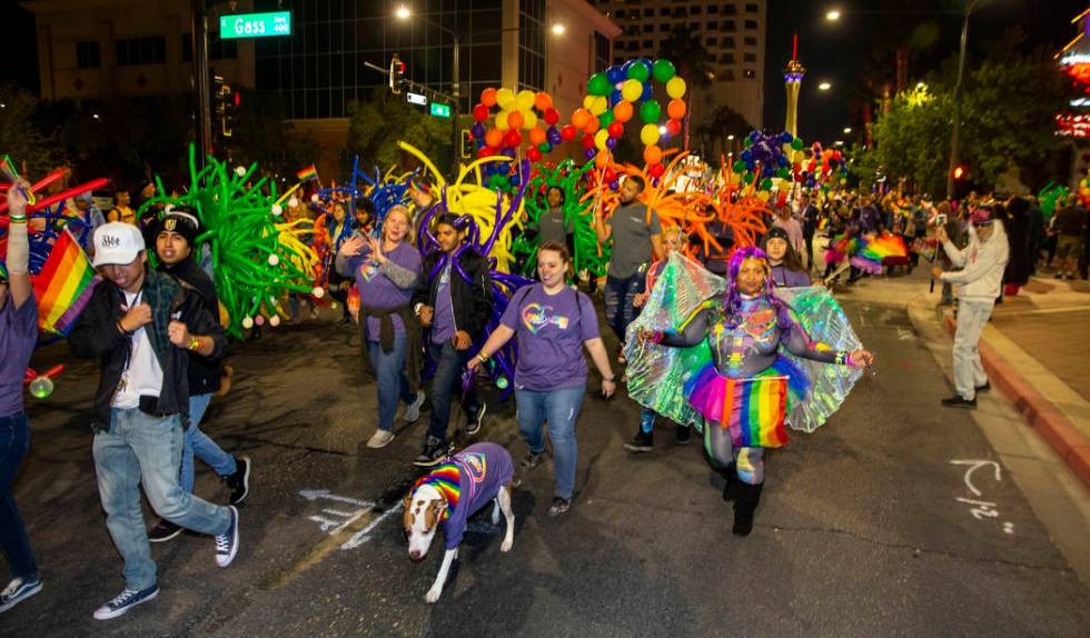 Participants move up S. Fourth Street during the annual Las Vegas Pride Night Parade on Friday, ...