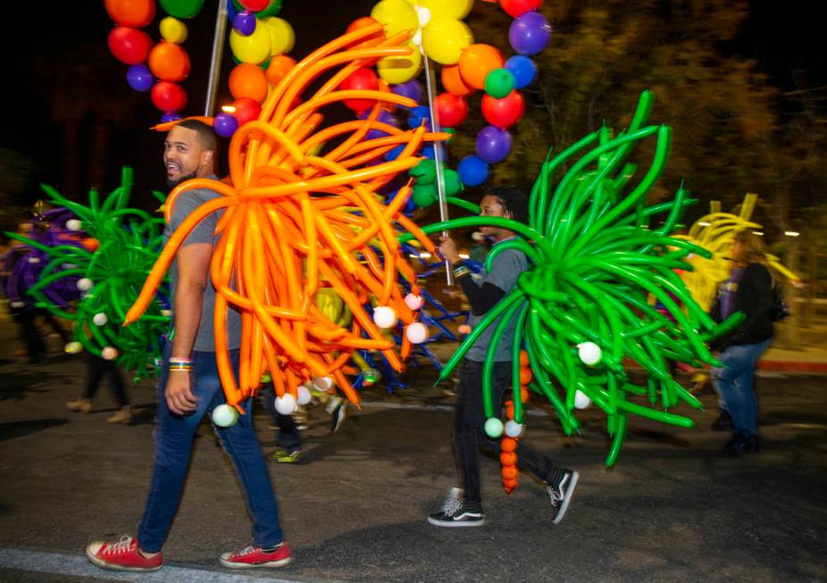 Participants in balloon costumes move up S. Fourth Street during the annual Las Vegas Pride Nig ...