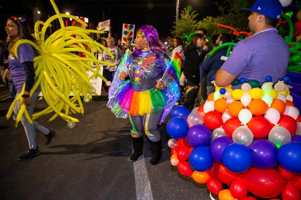 Participants in costumes march up S. Fourth Street during the annual Las Vegas Pride Night Para ...