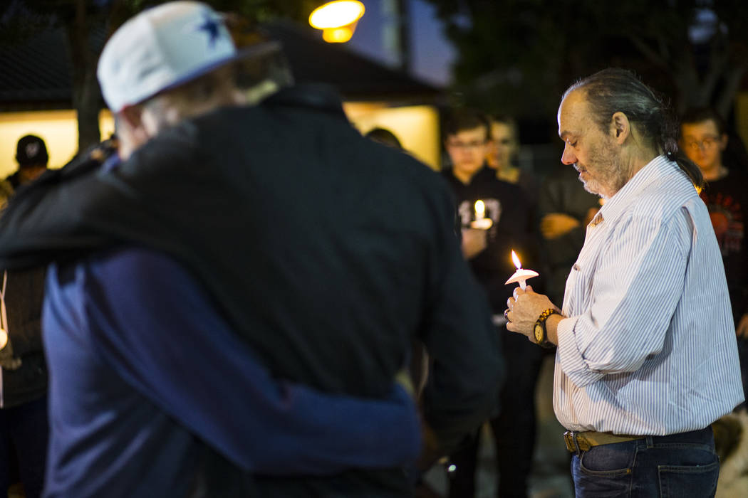 Chuck Wheeler, right, mourns the loss of his grandson, Gavin Murray Palmer, who was lost in a h ...