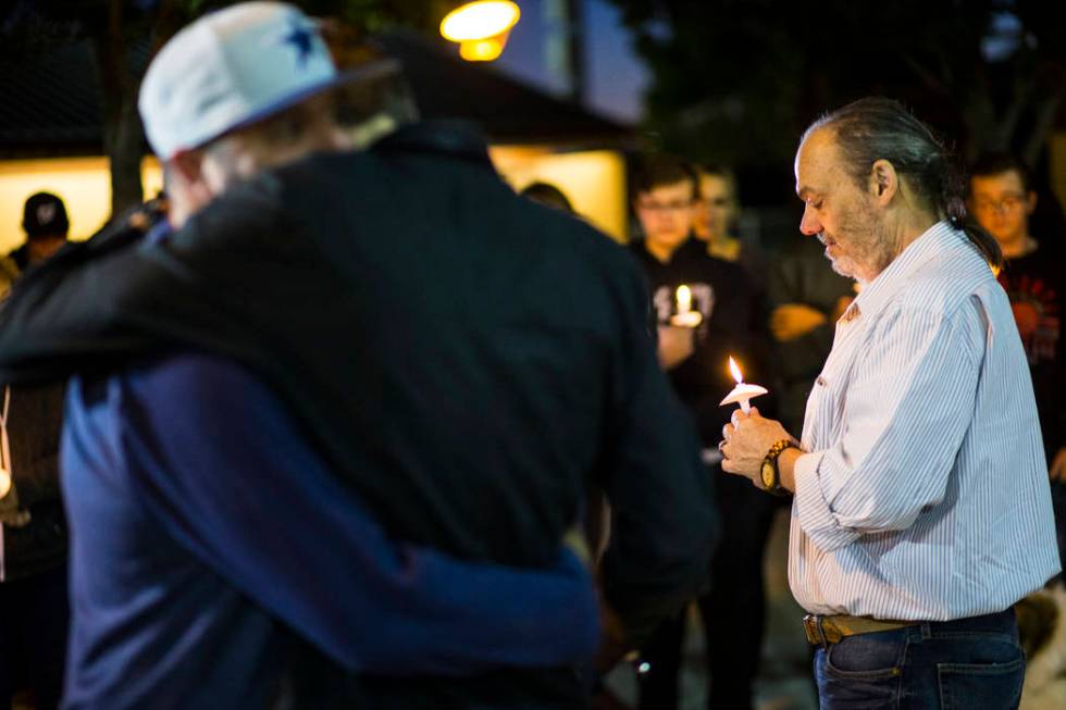 Chuck Wheeler, right, mourns the loss of his grandson, Gavin Murray Palmer, who was lost in a h ...