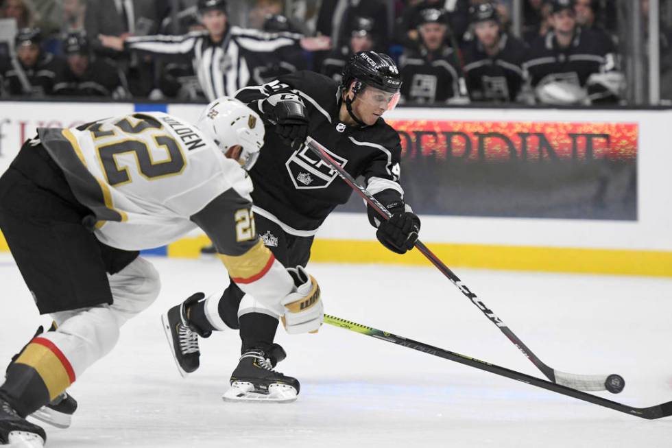 Los Angeles Kings center Blake Lizotte shoots as Vegas Golden Knights defenseman Nick Holden (2 ...